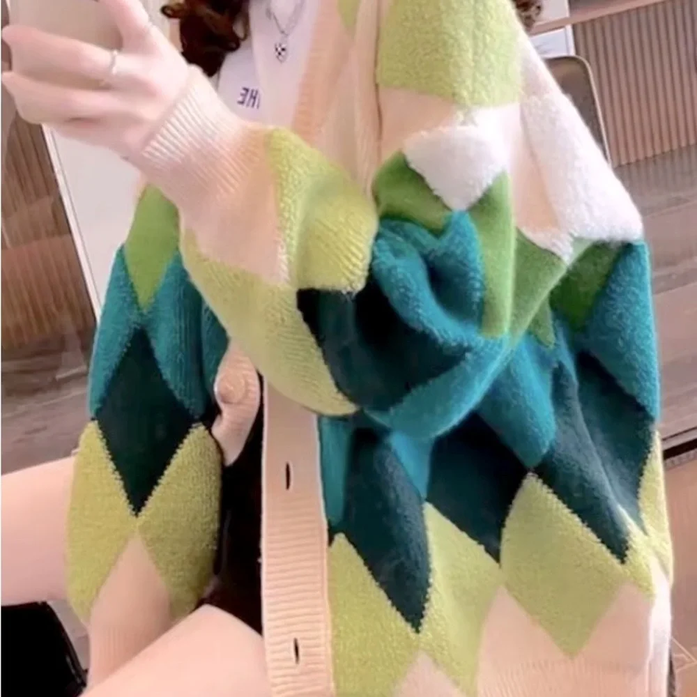 Green and cream harlequin patterned button up sweater